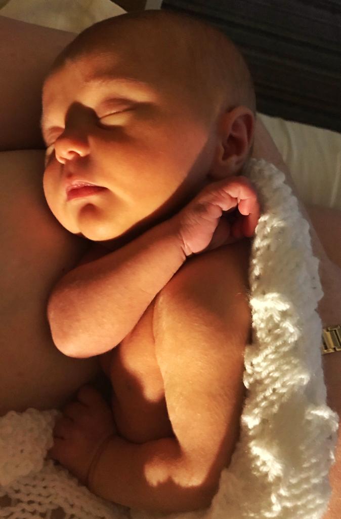 a peaceful sleeping baby in the golden evening light